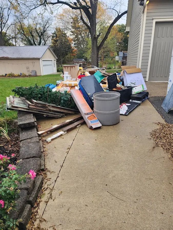Dumpster being loaded with debris for Residential Dumpster Rental in North Myrtle Beach